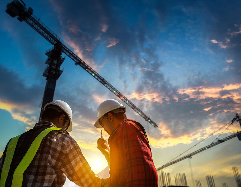 Construction workers looking at design plans